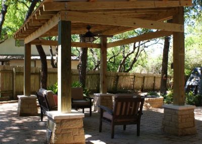 Pergola with stone columns and pavers